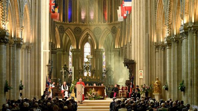 Bishop Jean-Claude Boulanger leads a ceremony at the Cathedral of Bayeux. Britain’s Prince Charles, his wife Camilla and Prime Minister Theresa May attended a service of remembrance at the medieval cathedral in Bayeux, the first Normandy town liberated by Allied troops after D-Day. Cardinal Marc Ouellet read a message from Pope Francis with a tribute for those who “gave their lives for freedom and peace.” (Bertrand Guay / AFP)
