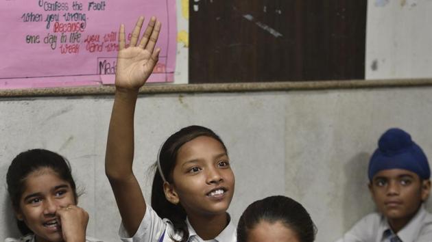 New Delhi, India - Aug. 21, 2018: Students listening to the teacher in the classroom during Happiness Class, an initiative of Delhi Government in every government school till 8th class at Kautilya Government Sarvodaya Bal Vidyalaya, Chirag Enclave, in New Delhi, India, on Tuesday, August 21, 2018. (Photo by Sanchit Khann a/ Hindustan Times) **To go with Manoj Sharma's Story (Sanchit Khanna/HT PHOTO) New Delhi, India - Aug. 21, 2018: Students listening to the teacher in the classroom during Happiness Class, an initiative of Delhi Government in every government school till 8th class at Kautilya Government Sarvodaya Bal Vidyalaya, Chirag Enclave, in New Delhi, India, on Tuesday, August 21, 2018. (Photo by Sanchit Khann a/ Hindustan Times) **To go with Manoj Sharma's Story (Sanchit Khanna/HT PHOTO)