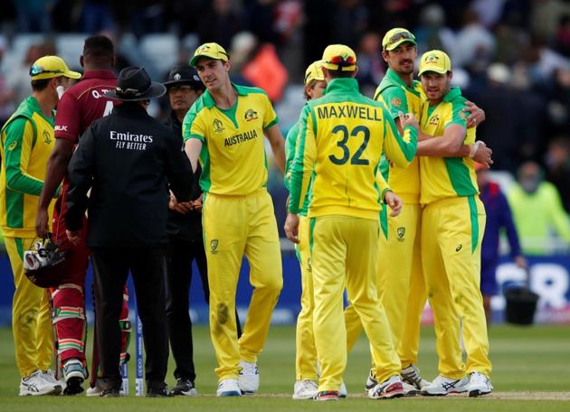 Australia's Nathan Coulter-Nile celebrates with Mitchell Starc and team mates at the end of the match. (Action Images via Reuters)