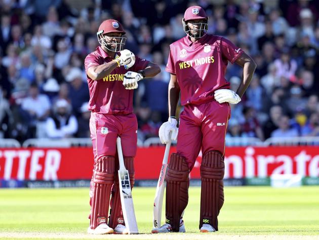 Nottingham: West Indies' captain Jason Holder, right, and Andre Russell stand between the wickets during the Cricket World Cup match between Australia and West Indies at Trent Bridge in Nottingham. (AP)