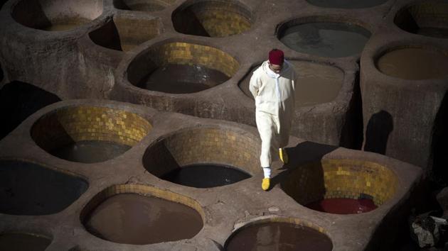 A man walks inside a tannery from the 9th century walled medina in the ancient city. Fez is the spiritual capital of Morocco, famed for its culture and its age-old handicraft work. Abderahim Belkhayat, head of a regional body of artisans, said an influx of visitors to Fez “benefits” craftsmen, noting that three quarters of the medina’s residents earn a living directly or indirectly from the sector. (Fadel Senna / AFP)