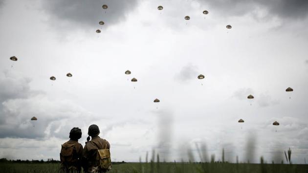 Paratroopers jump to commemorate D-Day over Sannverville in Normandy on June 5, 2019. The biggest-ever air and seaborne invasion took place on D-Day, involving nearly 160,000 troops and many more in the ensuing Battle of Normandy. Troops landed overnight from the air, then were joined by a massive force by sea on beaches code-named Omaha, Utah, Juno, Sword and Gold. (Christian Hartmann / REUTERS)
