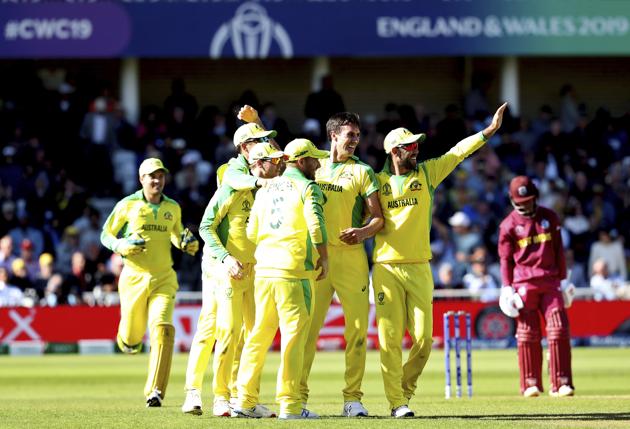 Australia's Pat Cummins, without cap, celebrates with teammates the dismissal of West Indies' Shai Hope during the Cricket World Cup match between Australia and West Indies at Trent Bridge in Nottingham. (AP)