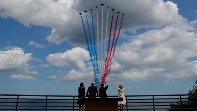 United States President Donald Trump, First Lady Melania Trump, French President Emmanuel Macron and his wife Brigitte Macron look to fly pasts in the Normandy American Cemetery to commemorate the 75th anniversary of the D-Day landings, in Normandy, France. (Carlos Barria / REUTERS) United States President Donald Trump, First Lady Melania Trump, French President Emmanuel Macron and his wife Brigitte Macron look to fly pasts in the Normandy American Cemetery to commemorate the 75th anniversary of the D-Day landings, in Normandy, France. (Carlos Barria / REUTERS)