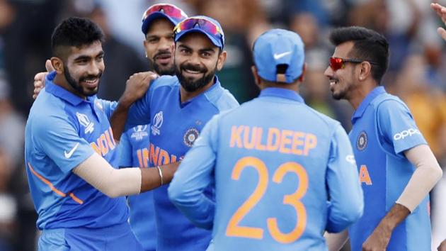 India's captain Virat Kohli, second left, celebrates after taking a catch to dismiss South Africa's Quinton de Kock off the bowling of India's Jasprit Bumrah, during their Cricket World Cup match.(AP)