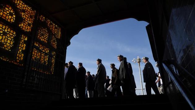 Uighur men make their way past a subway entrance after Eid-ul-Fitr prayers, marking the end of Ramzan, at the Idkah mosque in Kashgar, in China’s Xinjiang region. While Muslims around the world celebrated the end of Ramzan with prayers and festivities, the recent destruction of dozens of mosques in Xinjiang highlights the increasing pressure Uighurs and other ethnic minorities face in the heavily policed region. (Greg Baker / AFP) Uighur men make their way past a subway entrance after Eid-ul-Fitr prayers, marking the end of Ramzan, at the Idkah mosque in Kashgar, in China’s Xinjiang region. While Muslims around the world celebrated the end of Ramzan with prayers and festivities, the recent destruction of dozens of mosques in Xinjiang highlights the increasing pressure Uighurs and other ethnic minorities face in the heavily policed region. (Greg Baker / AFP)