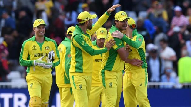 Australia's Mitchell Starc (2nd R) is congratulated by teammates after taking five wickets in their win in the 2019 Cricket World Cup group stage match between Australia and West Indies at Trent Bridge in Nottingham, central England, on June 6, 2019. - Australia beat West Indies by 15 runs.(AFP)