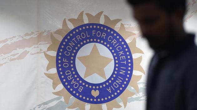 A man walks in front of the logo for the Board of Control for Cricket in India (BCCI). (AFP) A man walks in front of the logo for the Board of Control for Cricket in India (BCCI). (AFP)