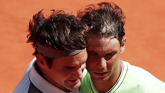 Switzerland's Roger Federer and Spain's Rafael Nadal after their semifinal match. REUTERS/Benoit Tessier TPX IMAGES OF THE DAY (REUTERS) Switzerland's Roger Federer and Spain's Rafael Nadal after their semifinal match. REUTERS/Benoit Tessier TPX IMAGES OF THE DAY (REUTERS)