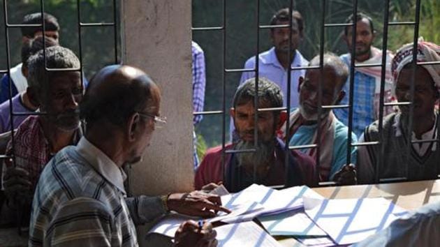 People wait to check their names on the first draft of the National Register of Citizens (NRC) at Goroimari of Kamrup district in the Indian state of Assam on January 1, 2018. Image used for representational purpose. (AFP/ File photo) People wait to check their names on the first draft of the National Register of Citizens (NRC) at Goroimari of Kamrup district in the Indian state of Assam on January 1, 2018. Image used for representational purpose. (AFP/ File photo)