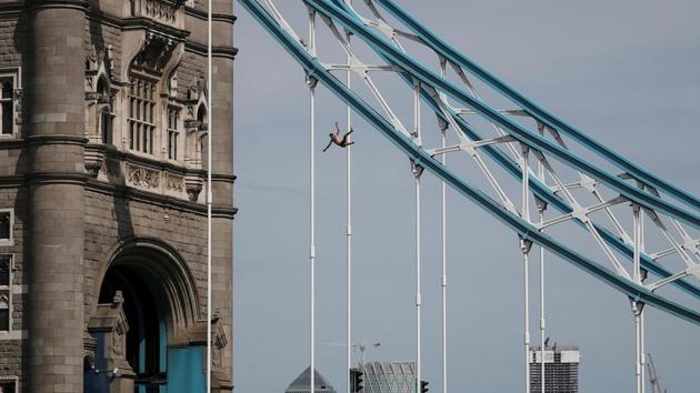 A man jumps off the Tower Bridge in London, Britain. (Alkis Konstantinidis / REUTERS) A man jumps off the Tower Bridge in London, Britain. (Alkis Konstantinidis / REUTERS)