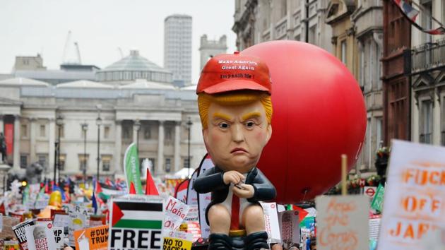 An effigy of US President Donald Trump is carried by protestors demonstrating against the visit of US President Donald Trump along white hall in London on the second day of Trump's three-day State Visit to the United Kingdom. (Tolga Akmen / AFP) An effigy of US President Donald Trump is carried by protestors demonstrating against the visit of US President Donald Trump along white hall in London on the second day of Trump's three-day State Visit to the United Kingdom. (Tolga Akmen / AFP)