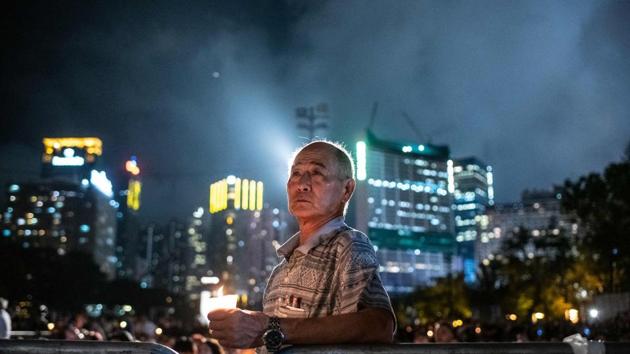 A man holds a candle during a candlelight vigil at Victoria Park in Hong Kong to mark the 30th anniversary of the 1989 Tiananmen crackdown in Beijing, China. (Philip Fong / AFP) A man holds a candle during a candlelight vigil at Victoria Park in Hong Kong to mark the 30th anniversary of the 1989 Tiananmen crackdown in Beijing, China. (Philip Fong / AFP)