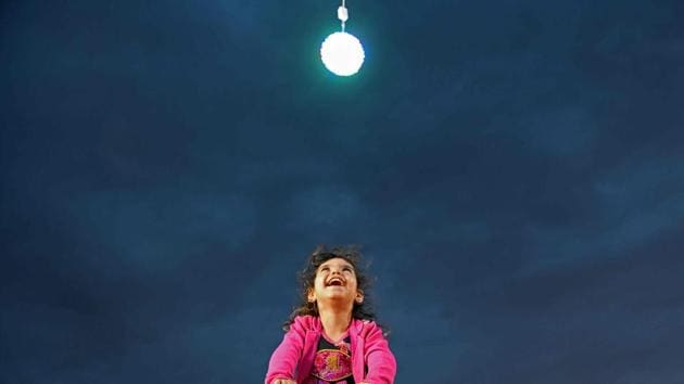 A Syrian girl smiles at an amusement park near an IDP camp for displaced persons in the area of Afrin, along Syria's northern border with Turkey during Eid al-Fitr which masks the end of the Muslim holy fasting month of Ramzan. (Rami al Sayed / AFP) A Syrian girl smiles at an amusement park near an IDP camp for displaced persons in the area of Afrin, along Syria's northern border with Turkey during Eid al-Fitr which masks the end of the Muslim holy fasting month of Ramzan. (Rami al Sayed / AFP)
