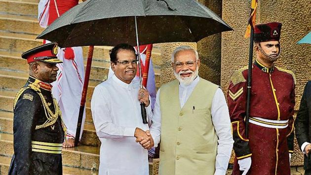 Prime Minister Narendra Modi, center is received by the Sri Lankan President Maithripala Sirisena, center left, upon his arrival at the presidential secretariat in Colombo, Sri Lanka(AP Photo)