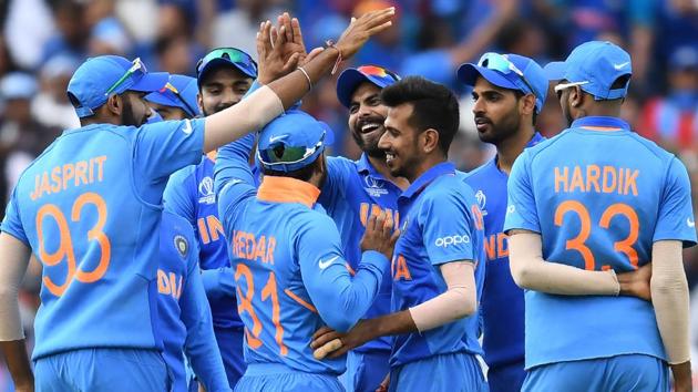 India's Ravindra Jadeja (C) celebrates after taking a catch to dismiss Australia's Glenn Maxwell. (AFP)