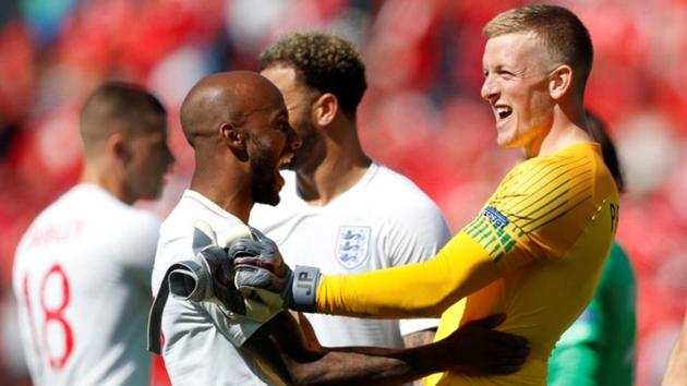 England's Jordan Pickford celebrates with Fabian Delph after the match.(REUTERS)