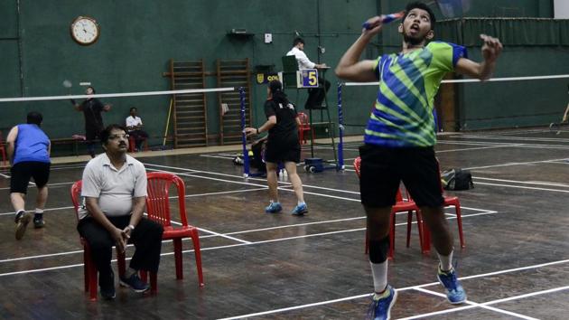 Arya Bhivpathaki in action during the Pune District Badminton Championship underway at Modern Sports complex in Shivajinagar.(Ravindra Joshi/HT PHOTO)