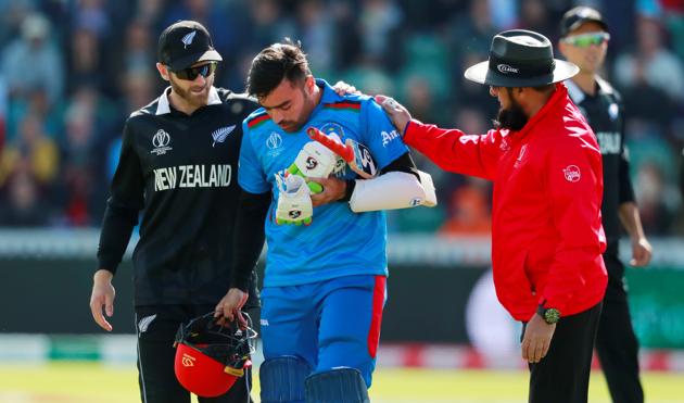 Kane Williamson helps Afghanistan's Rashid Khan after he is bowled by New Zealand's Lockie Ferguson. (Reuters)