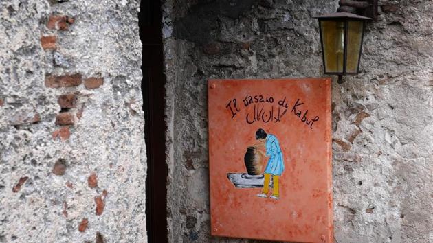 The sign at an abandoned ethnic shop reads “The potter of Kabul”. Former mayor Domenico “Mimmo” Lucano encouraged migrants and refugees to come to the village. Subsequently in 2010, German director Wim Wenders made a documentary featuring the leftist mayor and Riace’s refugees, but last year Lucano was placed under house arrest for allegedly setting up fake marriages to help foreign women stay in the country after their asylum applications were rejected. (Alberto Pizzoli / AFP) 