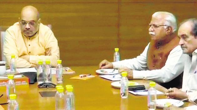 Union home minister and BJP chief Amit Shah with Haryana chief minister Manohar Lal Khattar and other party leaders during a meeting in New Delhi on Sunday. (HT Photo) Union home minister and BJP chief Amit Shah with Haryana chief minister Manohar Lal Khattar and other party leaders during a meeting in New Delhi on Sunday. (HT Photo)