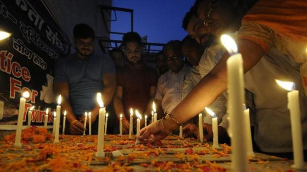 People gathered in solidarity and lit candles for the victim of the Aligarh murder case, calling for justice and lighting, at Sector 34, in Noida on Sunday.(Sunil Ghosh /HT Photo)