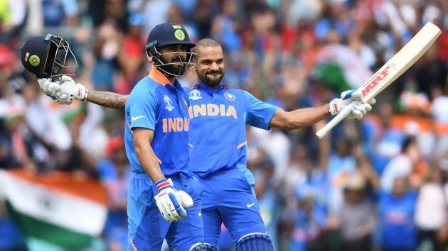 India's Shikhar Dhawan (R) celebrates after scoring a century (100 runs) alongside India's captain Virat Kohliduring the 2019 Cricket World Cup group stage match between India and Australia at The Oval in London on June 9, 2019(AFP)