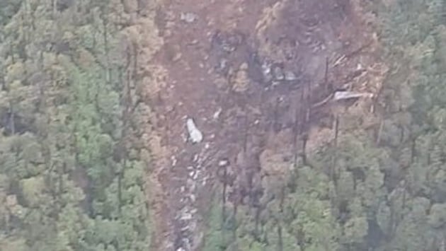 The wreckage of the AN-32 aircraft of the Indian Air Force in the mountains of Siang district of Arunachal Pradesh.(ANI photo/Twitter) The wreckage of the AN-32 aircraft of the Indian Air Force in the mountains of Siang district of Arunachal Pradesh.(ANI photo/Twitter)