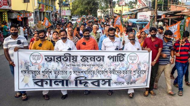 BJP activists take part in a silent march as they observe Black Day over the killing of their party workers in various political clashes, Balurghat, South Dinajpur, West Bengal, June 10, 2019 (PTI) BJP activists take part in a silent march as they observe Black Day over the killing of their party workers in various political clashes, Balurghat, South Dinajpur, West Bengal, June 10, 2019 (PTI)