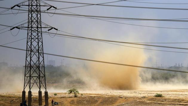 A whirlwind brews during a dust storm in the afternoon near the banks of the river Yamuna in New Delhi. The weather forecasting agency has predicted that tomorrow (June 12), the capital will be hit by thunderstorm or dust storm. (Amal KS / HT Photo) A whirlwind brews during a dust storm in the afternoon near the banks of the river Yamuna in New Delhi. The weather forecasting agency has predicted that tomorrow (June 12), the capital will be hit by thunderstorm or dust storm. (Amal KS / HT Photo)
