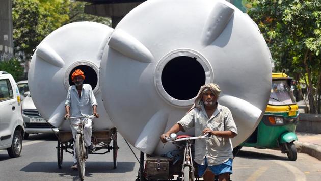 A cycle rickshaw puller transports a water tank on a summer day in New Delhi. According to private forecaster Skymet, rains are expected to continue on Wednesday and Thursday, bringing the mercury below 40-43 degree Celsius. Later, there will be no chances of heatwave conditions due to the arrival of monsoon as westerly dry winds will stop and easterly winds filled with moisture will come to the northern region. (Amal KS / HT Photo) A cycle rickshaw puller transports a water tank on a summer day in New Delhi. According to private forecaster Skymet, rains are expected to continue on Wednesday and Thursday, bringing the mercury below 40-43 degree Celsius. Later, there will be no chances of heatwave conditions due to the arrival of monsoon as westerly dry winds will stop and easterly winds filled with moisture will come to the northern region. (Amal KS / HT Photo)