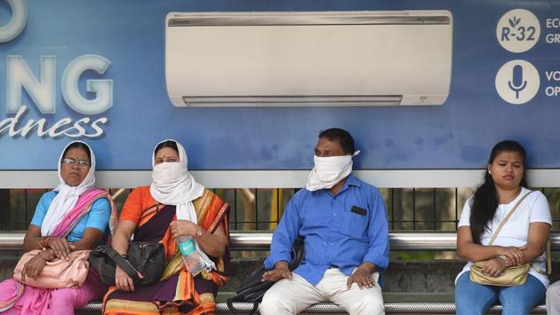People use handkerchiefs to protect themselves from the heat on a hot day, at Civil Lines, in New Delhi.“Heavy rain warning has been issued for Saurashtra and Kutch on June 13 and 14 due to the depression in the Arabian Sea which will turn into a severe cyclonic storm,” reports said. (Raj K Raj / HT Photo) People use handkerchiefs to protect themselves from the heat on a hot day, at Civil Lines, in New Delhi.“Heavy rain warning has been issued for Saurashtra and Kutch on June 13 and 14 due to the depression in the Arabian Sea which will turn into a severe cyclonic storm,” reports said. (Raj K Raj / HT Photo)