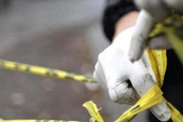 A forensic technician ties a used police line together to seal off a crime scene in Monterrey. (Reuters Photo/Daniel Becerril) A forensic technician ties a used police line together to seal off a crime scene in Monterrey. (Reuters Photo/Daniel Becerril)