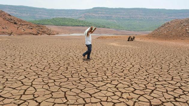 A man walks on the dried-up bed of Shivsagar Lake in Satara, Maharashtra. With water sources drying up in many parts of Maharashtra, over 560 villages and hamlets were added in the past week to the list of areas being supplied water by tankers. Overall, the state has only 7.2% water stock left in all its dams and reservoirs while Marathwada, the most affected, is heading towards zero water stock with only 0.66% water in its reservoirs. (PTI) A man walks on the dried-up bed of Shivsagar Lake in Satara, Maharashtra. With water sources drying up in many parts of Maharashtra, over 560 villages and hamlets were added in the past week to the list of areas being supplied water by tankers. Overall, the state has only 7.2% water stock left in all its dams and reservoirs while Marathwada, the most affected, is heading towards zero water stock with only 0.66% water in its reservoirs. (PTI)