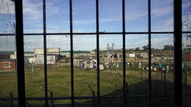There are bakeries and barbershops, a candy store and carpenter shop along streets where inmates mix with prison officials and police. One inmate carries a begonia he bought from a prisoner-owned nursery to give to his mother when she visits. “It’s been demonstrated everywhere that confinement doesn’t change people. Here the idea is to play at reality,” Parodi said. “If something fails, it fails. Just like in the real world.” (Matilde Campodonico / AP)
