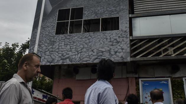 Six aluminium panels on the east façade of Churchgate station fell on three pedestrians on Wednesday. (Kunal Patil/HT Photo) Six aluminium panels on the east façade of Churchgate station fell on three pedestrians on Wednesday. (Kunal Patil/HT Photo)