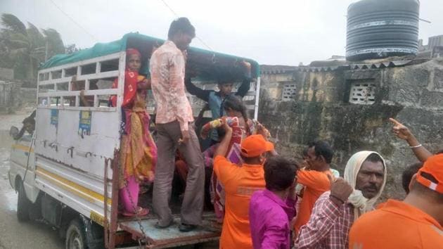 NDRF officials transport people to a safer place during the course of cyclone Vayu in Daman. (ANI) NDRF officials transport people to a safer place during the course of cyclone Vayu in Daman. (ANI)