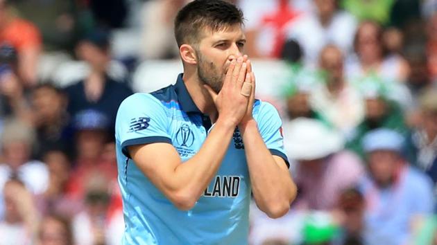 England's Mark Wood reacts while bowling during the 2019 Cricket World Cup group stage match.(AFP)