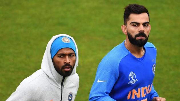 India's captain Virat Kohli (R) and India's Hardik Pandya attend a training session.(AFP)