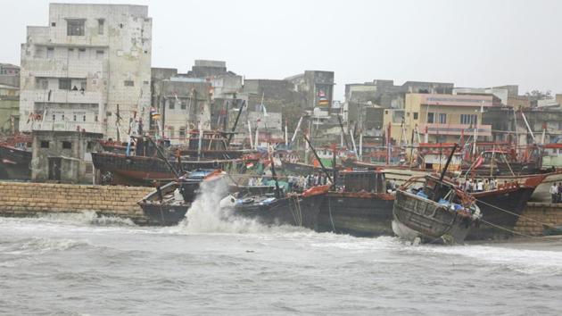 Fishing boats bombard on a wall due to heavy winds and huge waves in the Arabian sea at Veraval. (Ajit Solanki / AP) Fishing boats bombard on a wall due to heavy winds and huge waves in the Arabian sea at Veraval. (Ajit Solanki / AP)