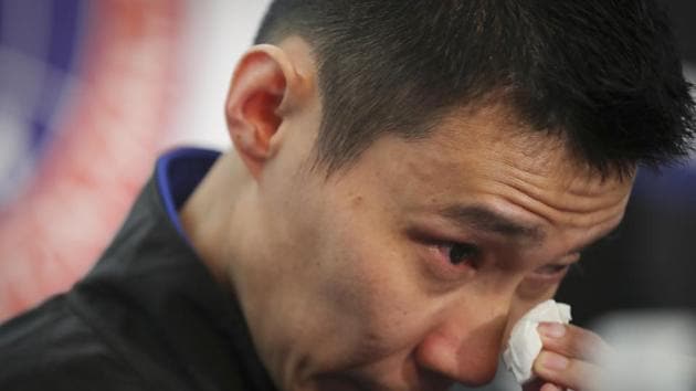 Malaysian badminton player Lee Chong Wei wipes his tears during a press conference in Putrajaya, Malaysia, Thursday, June 13, 2019. Former World No. 1-ranked Lee has announced his retirement from badminton after 19 years following his battle with cancer.(AP)