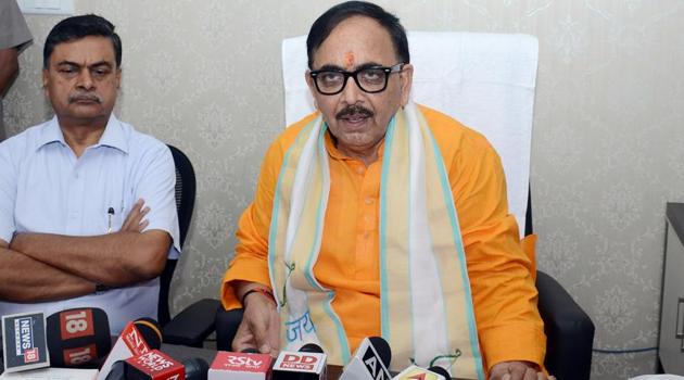 Uttar Pradesh BJP chief Mahendra Nath Pandey’s (in yellow kurta) induction in the Union cabinet has set in motion the process for appointment of the new state president.(ANI)