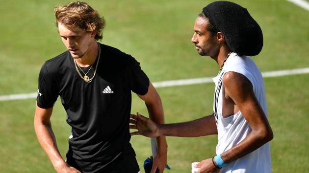 Germany's Alexander Zverev (L) shakes hands with Germany's Dustin Brown.(AFP)
