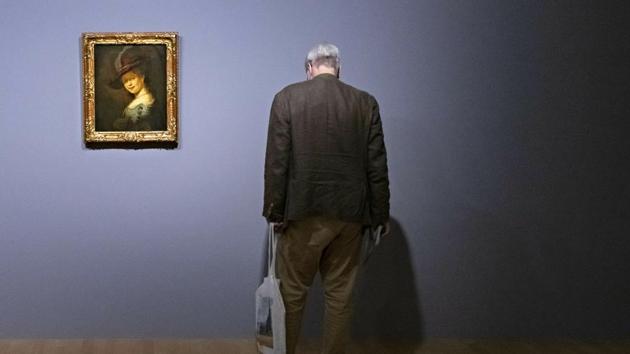 A visitor stands besides the painting ‘Bust of a young woman smiling (Saskia van Uylenburgh)’ (1633) by Rembrandt during a press preview of the exhibition ‘Rembrandt’s Mark’ in Dresden, Germany. The exhibition presents about 100 works from Rembrandt’s entire career in dialogue with about 50 etchings and drawings of selected contemporaries and later artists. (Jens Meyer / AP)