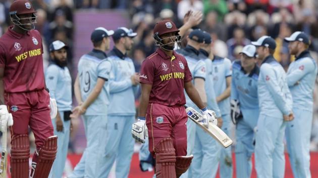 West Indies' Nicholas Pooran, centre, walks off the field of play after losing his wicket. (AP)