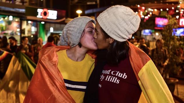 A couple celebrate with a kiss after Ecuador's Constitutional Court approved equal civil marriage, in Guayaquil. Ecuador's highest court approved same-sex marriage in a landmark ruling in the traditionally Catholic and conservative South American country. (Rodrigo Buendia / AFP)