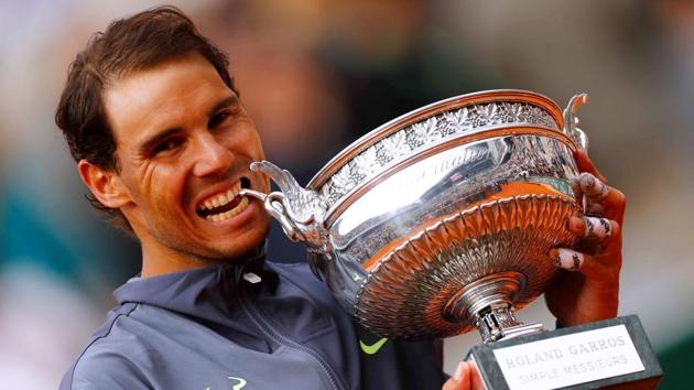 Spain's Rafael Nadal celebrates with the Roland-Garros trophy after his final match against Austria's Dominic Thiem, at Stade Roland-Garros, in Paris, France. (Kai Pfaffenbach / REUTERS)