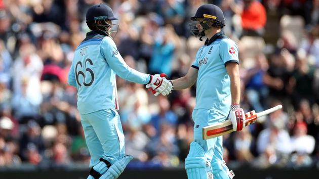 England's Joe Root celebrates a half century with Chris Woakes. (Action Images via Reuters)