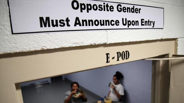 The image shows one of the signs over the doorways within the dedicated unit for transgender migrants in the Cibola County Correctional Center in Milan.(AP File Photo)