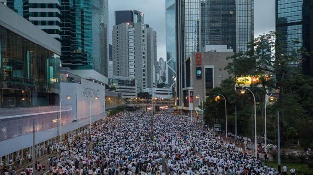 Protesters gather during a protest against a proposed extradition law in Hong Kong, China. Protesters blocked major roads in downtown Hong Kong vowed to stay until the government withdraws controversial legislation that would for the first time allow extraditions to China. (Paul Yeung / Bloomberg)